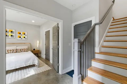a bedroom with a bed and a walk in closet
