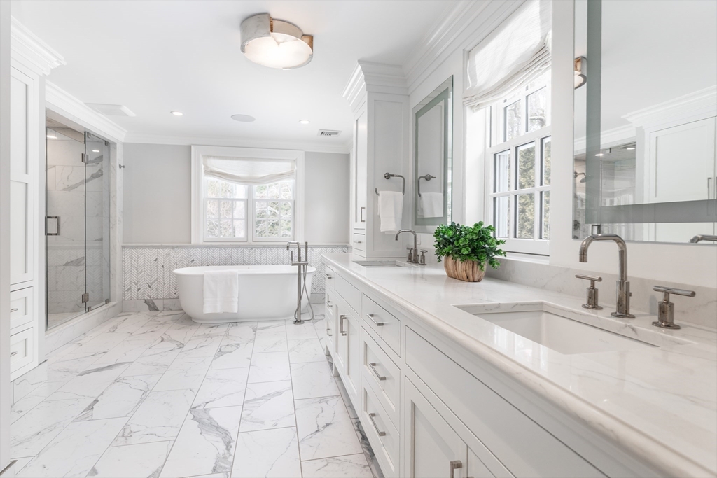 64 Albion Road Wellesley, MA 02481 - Photo 13 of 26 a spacious bathroom with a double vanity sink a mirror and a bathtub