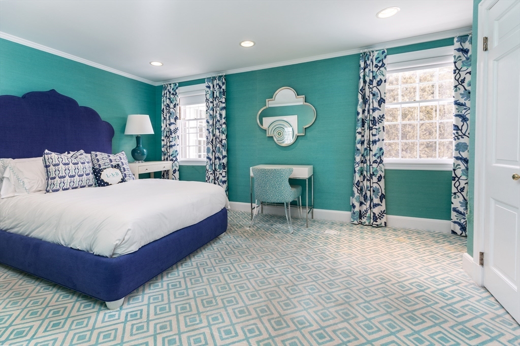 64 Albion Road Wellesley, MA 02481 - Photo 17 of 26 a spacious bedroom with a bed and a window