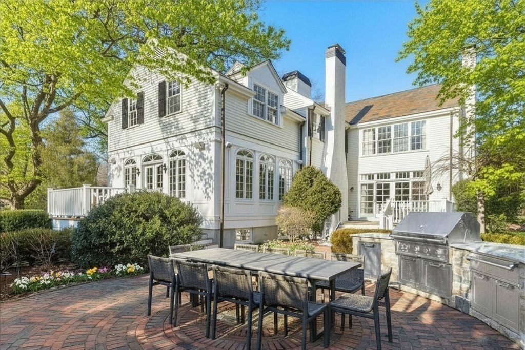 64 Albion Road Wellesley, MA 02481 - Photo 22 of 26 a view of a patio with table and chairs and potted plants