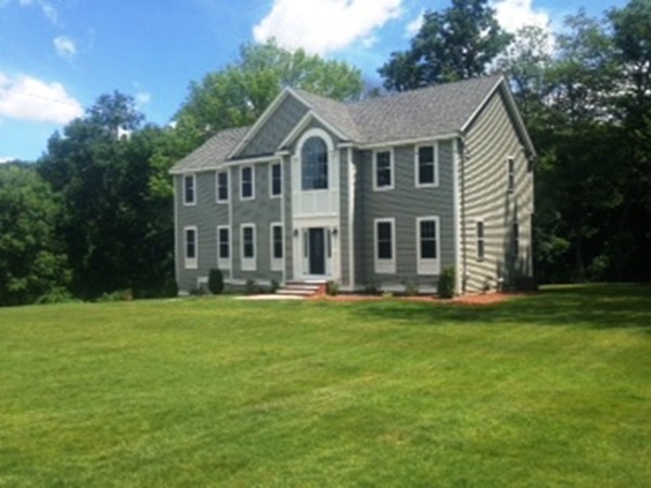 344 River Road Andover, MA 01810 - Photo 2 of 13 a front view of a house with a garden