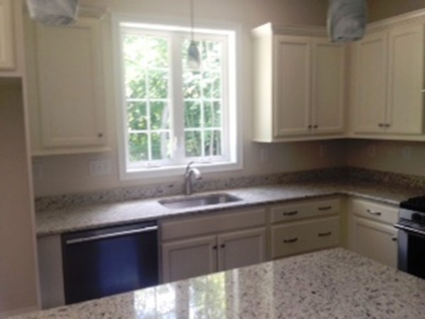 344 River Road Andover, MA 01810 - Photo 5 of 13 a kitchen with granite countertop a sink window and cabinets