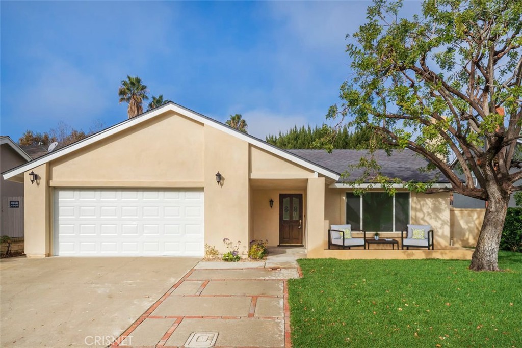 23661 Mill Valley Road Valencia, CA 91355 - Photo 1 of 1 a view of a house with backyard and a tree