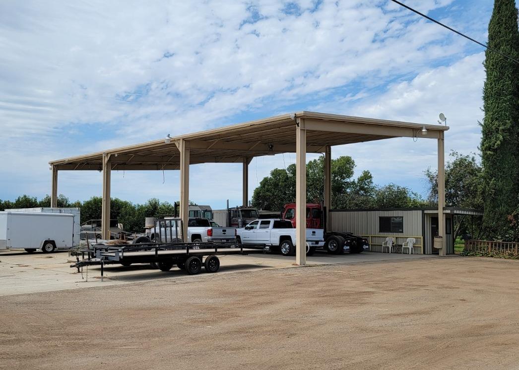12555 Comstock Road Stockton, CA 95215 - Photo 2 of 6 a view of swimming pool with lawn chairs under an umbrella
