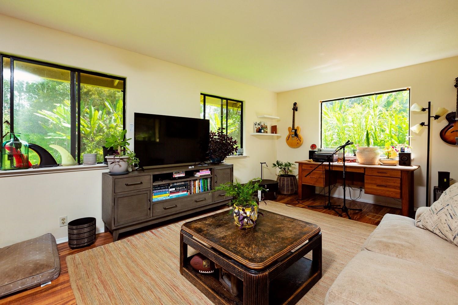 1034 Kaupakalua Road Haiku, HI 96708 - Photo 9 of 21 a living room with furniture and a flat screen tv