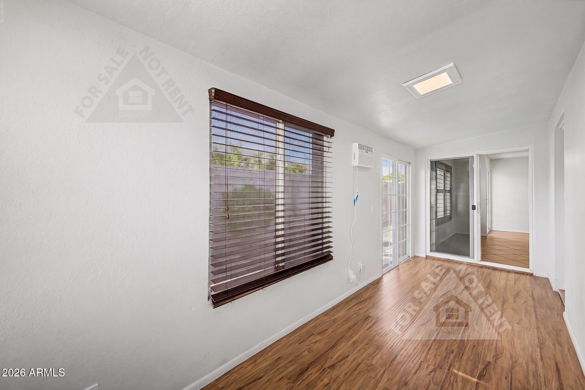 912 East Villa Rita Drive Phoenix, AZ 85022 - Photo 20 of 27 a view of empty room with wooden floor