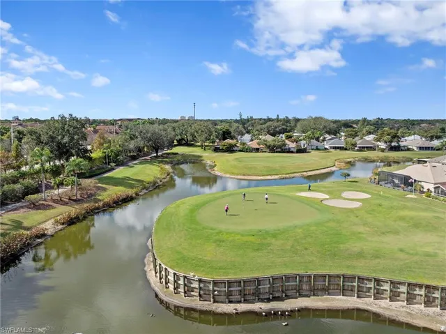 a view of a swimming pool with a table and chairs