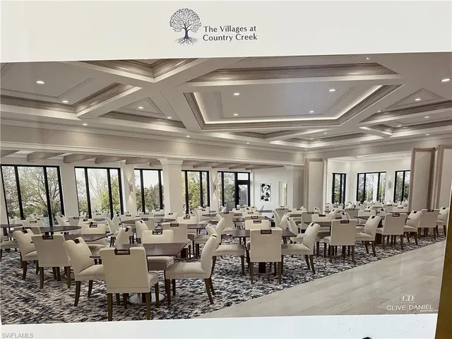 a very nice looking living room with lots of tables and chairs