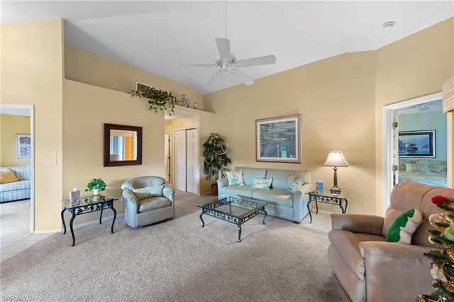 a living room with furniture and a lamp