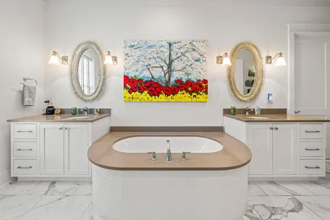 a bathroom with mirror sink and a mirror