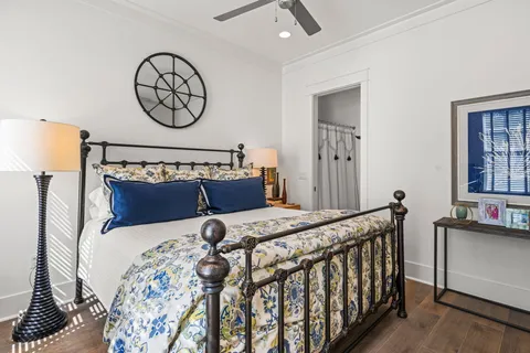 a bed sitting in a bedroom next to a window