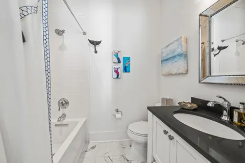 a bathroom with a sink a toilet and a bathtub