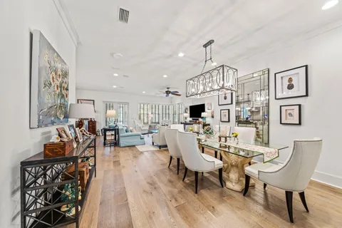 a living room with furniture a rug and a chandelier