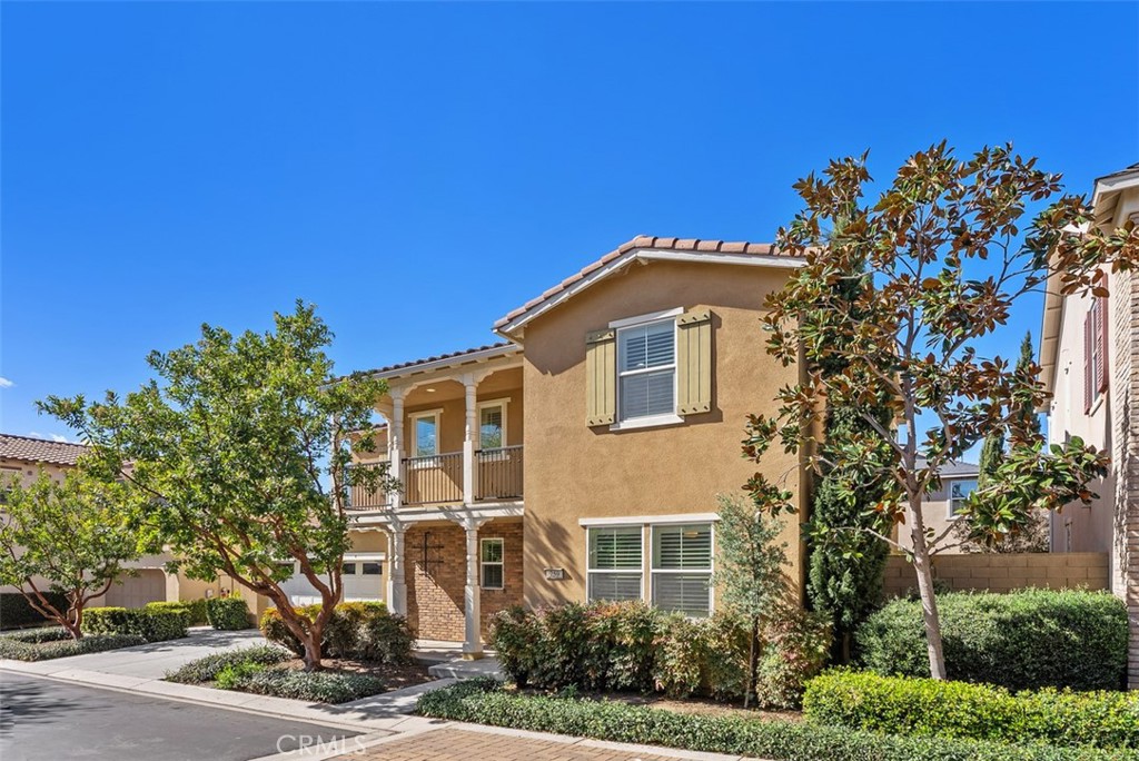 259 Wicker Irvine, CA 92618 - Photo 2 of 30 a front view of a house with a tree