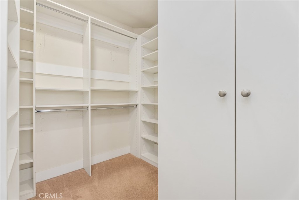 259 Wicker Irvine, CA 92618 - Photo 23 of 30 a view of walk in closet with empty racks