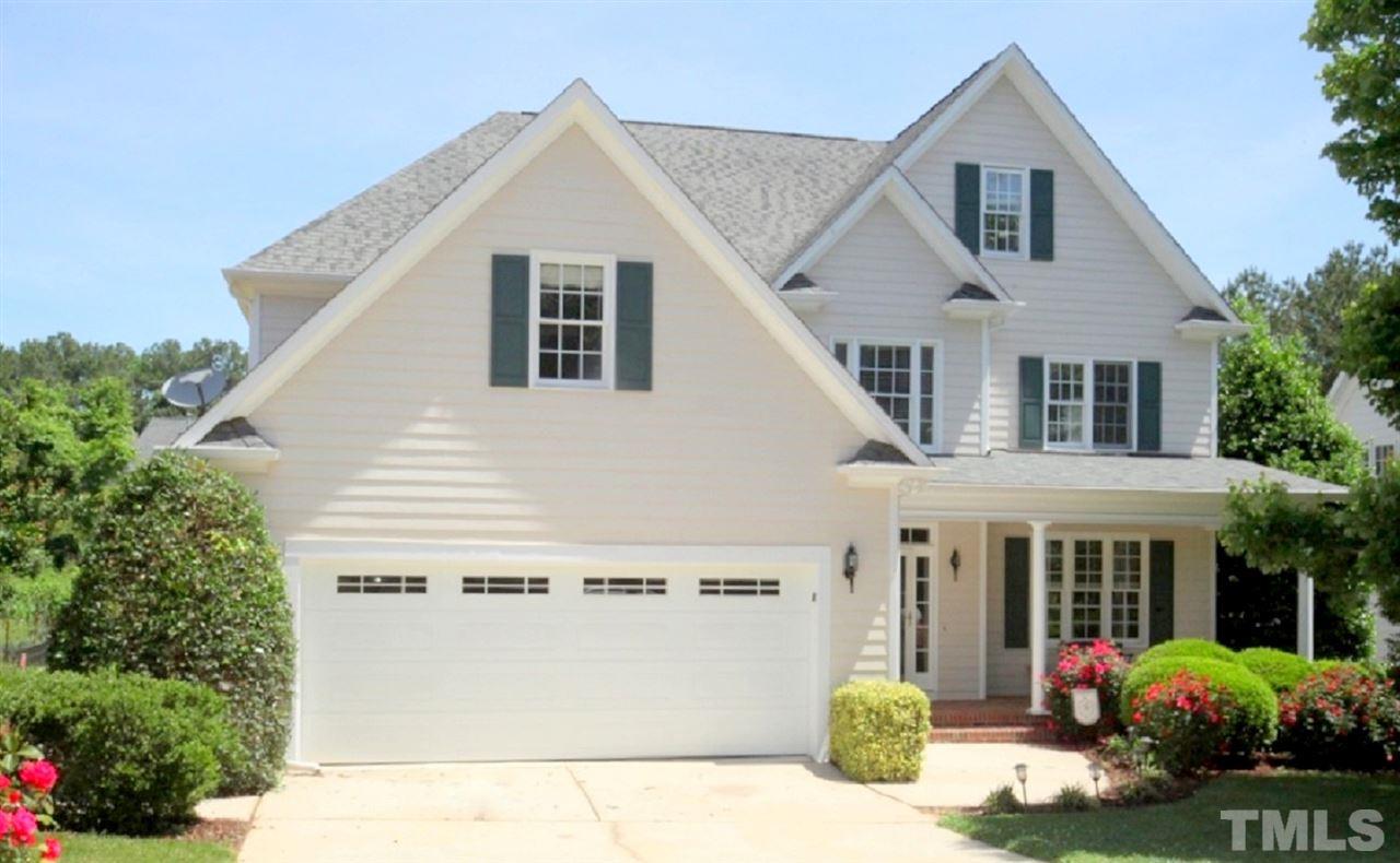 7712 Wilderness Road Raleigh, NC 27613 - Photo 1 of 25 a front view of a house with a porch