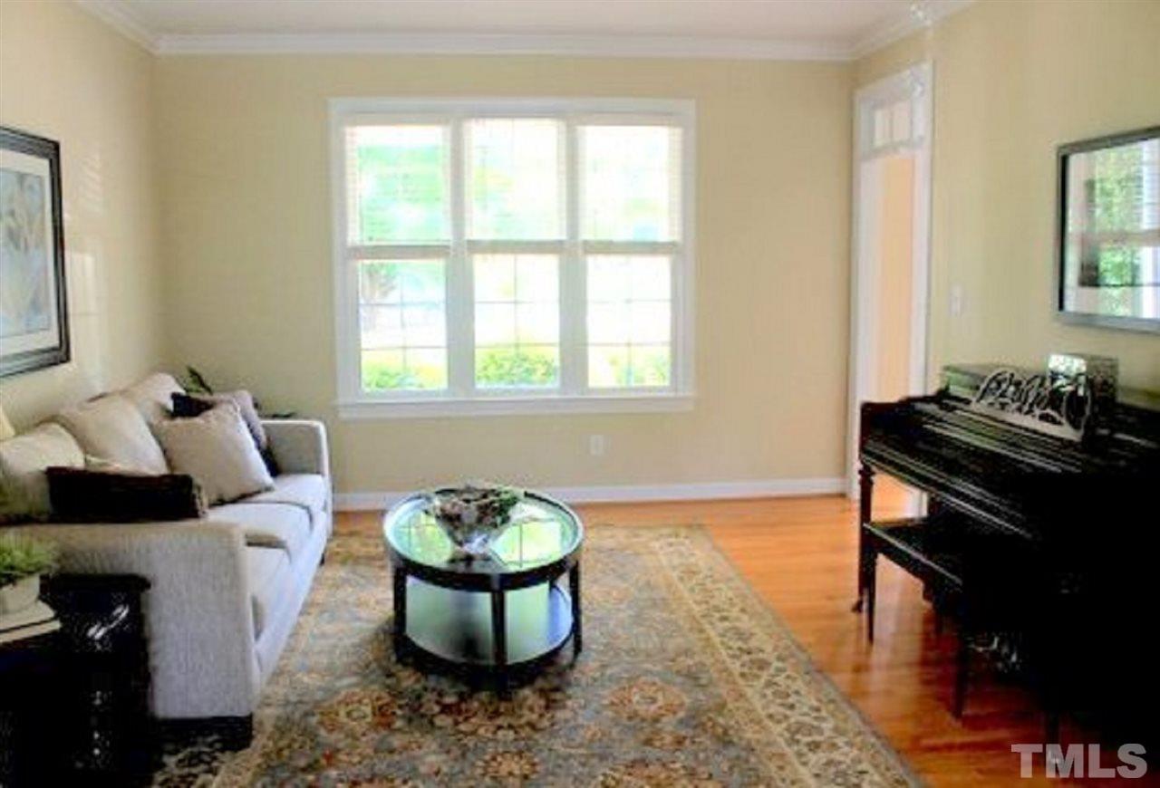 7712 Wilderness Road Raleigh, NC 27613 - Photo 12 of 25 a living room with furniture and a window