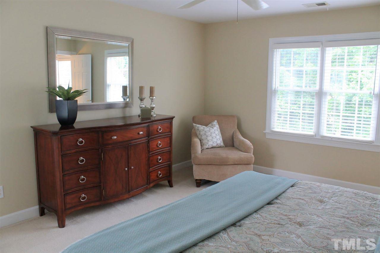 7712 Wilderness Road Raleigh, NC 27613 - Photo 15 of 25 a living room with furniture and a window