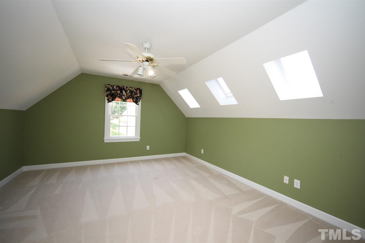 7712 Wilderness Road Raleigh, NC 27613 - Photo 19 of 25 a view of an empty room with a window