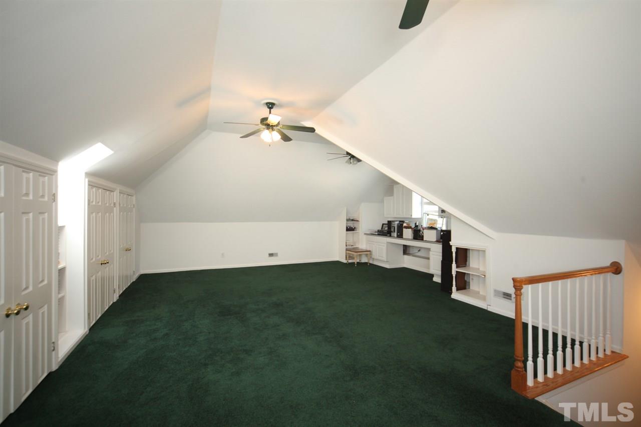 7712 Wilderness Road Raleigh, NC 27613 - Photo 20 of 25 a view of a livingroom with a staircase