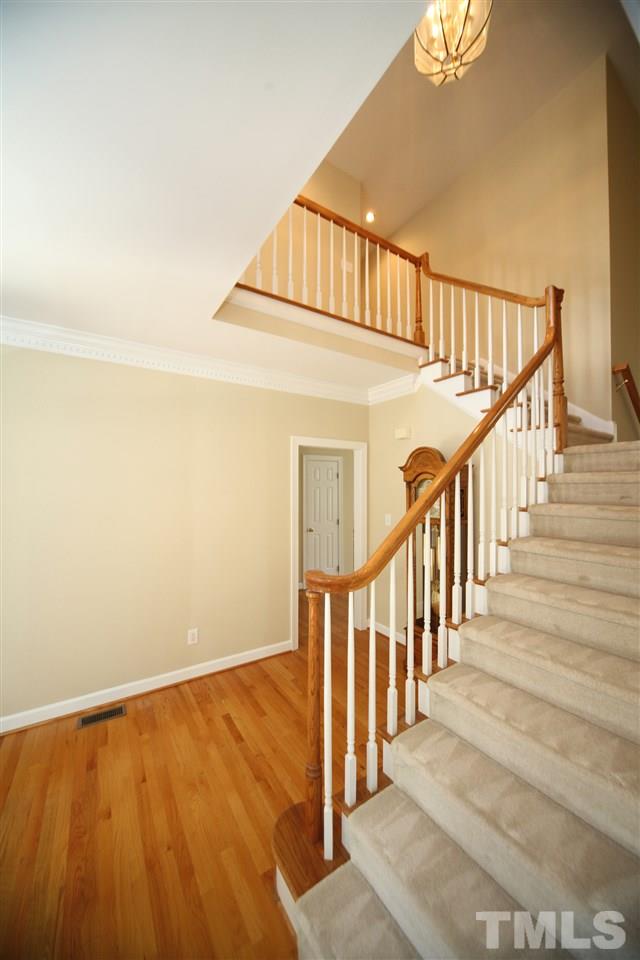 7712 Wilderness Road Raleigh, NC 27613 - Photo 3 of 25 a view of an entryway with staircase