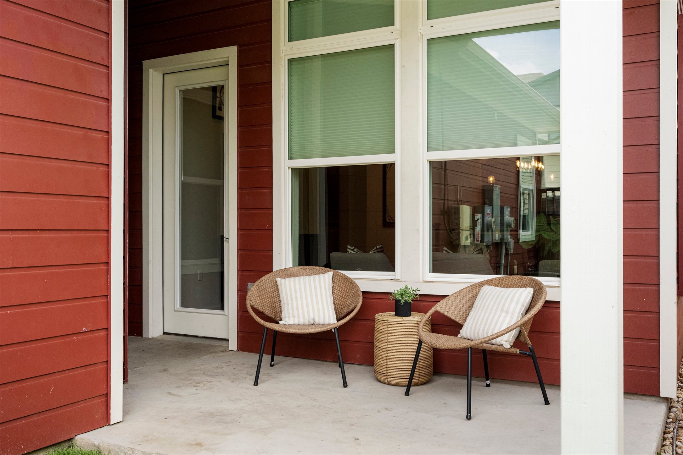 4313 Vaughan Street Austin, TX 78723 - Photo 33 of 39 The private back patio transitions between the main house and the garage, offering a perfect spot for morning coffee