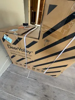 a view of a street with potted plants