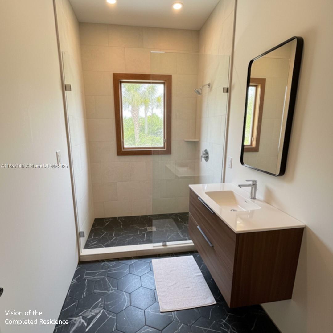 2235 Southwest 15th Street Miami, FL 33145 - Photo 7 of 17 a bathroom with a sink a toilet and mirror