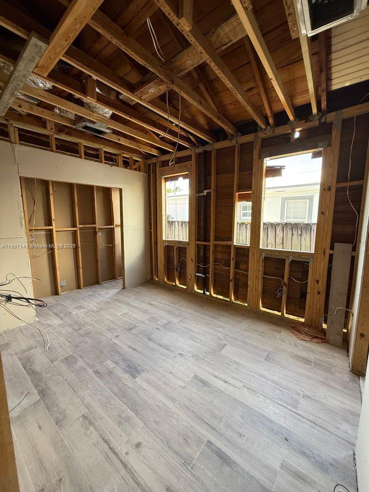 2235 Southwest 15th Street Miami, FL 33145 - Photo 10 of 17 a view of an empty room with wooden floor and windows