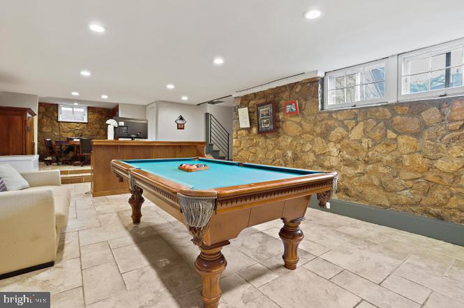 2347 South Arlington Ridge Road Arlington, VA 22202 - Photo 24 of 42 Stylish game room with stone accents.