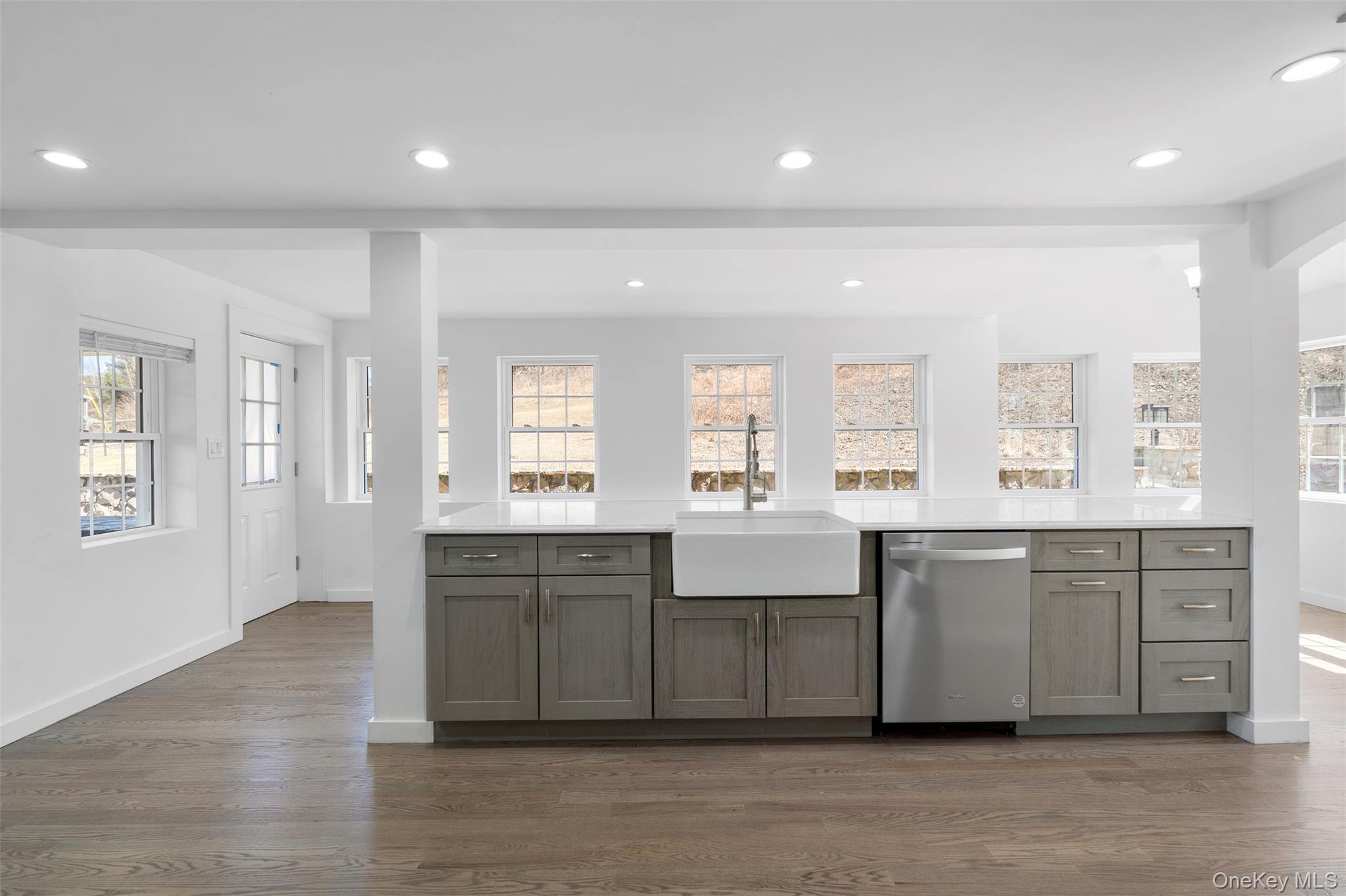 70 Barmore Road LaGrangeville, NY 12540 - Photo 9 of 47 Kitchen featuring dishwasher, dark wood finished floors, light countertops, recessed lighting, and gray cabinets