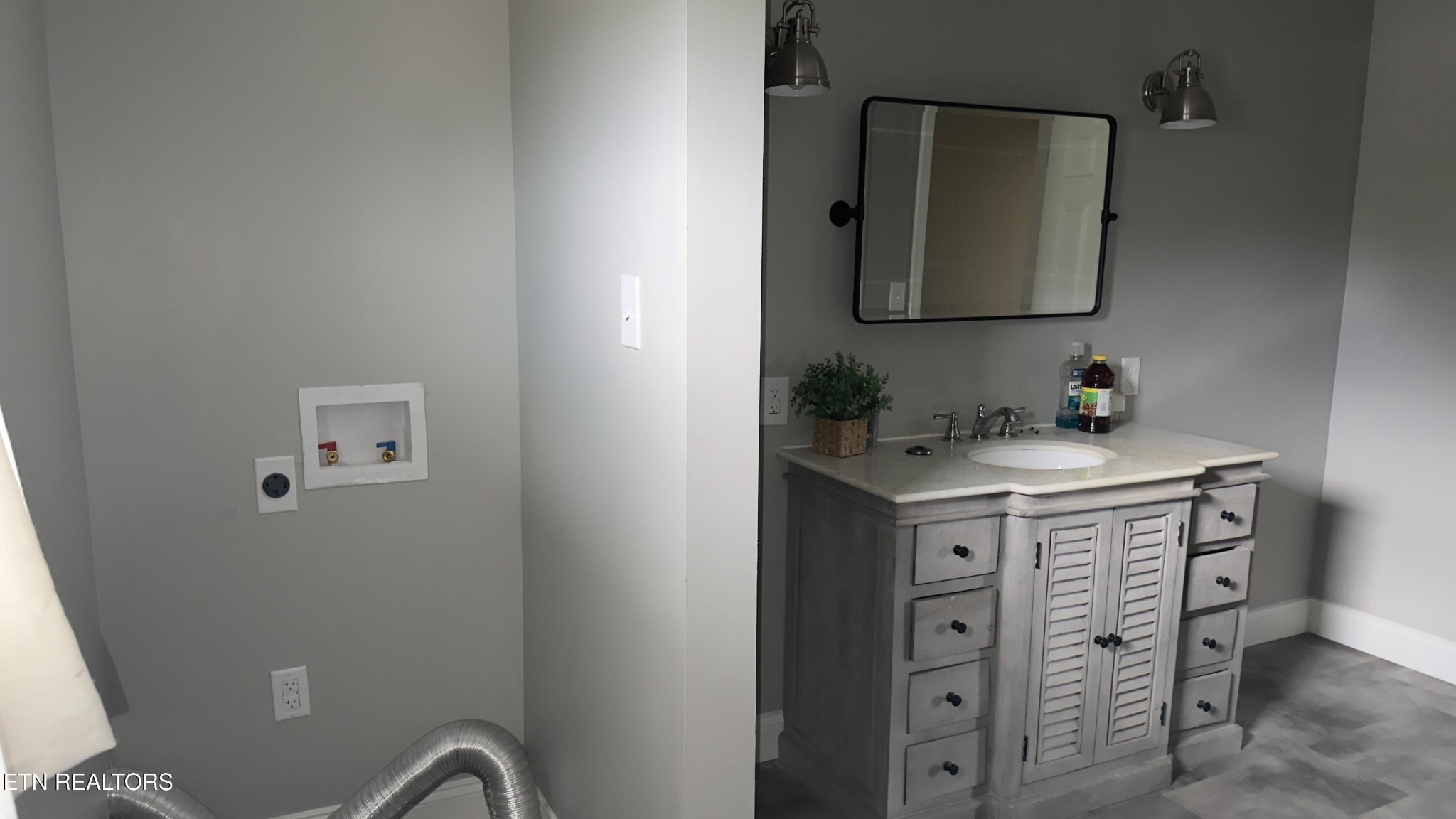 2662 Louisville Road Maryville, TN 37801 - Photo 18 of 60 a bathroom with a double vanity sink and a mirror