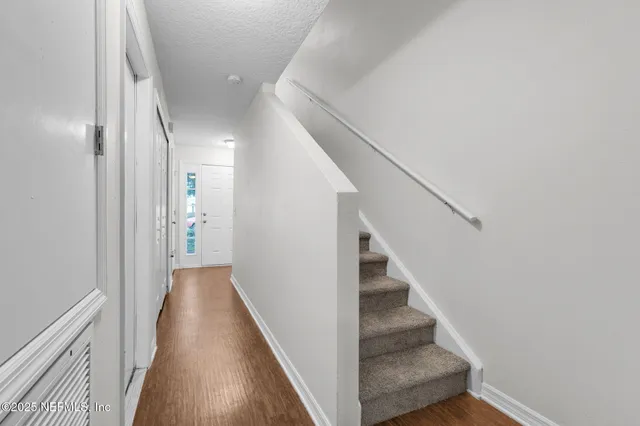 a view of a hallway with staircase