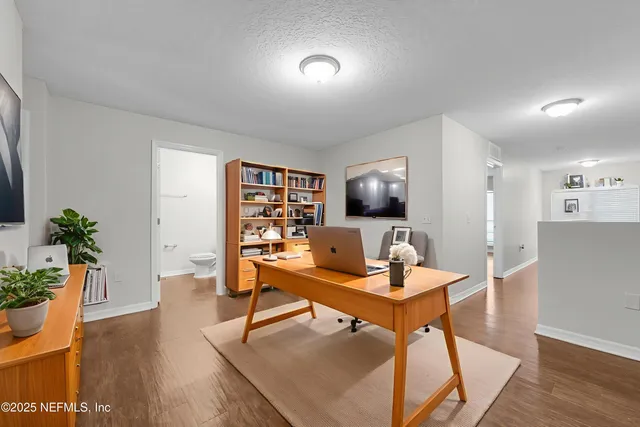 a workspace with furniture and wooden floor