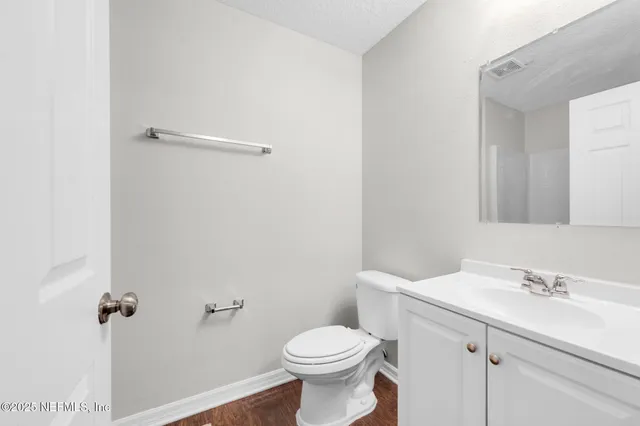 a bathroom with a sink toilet and vanity