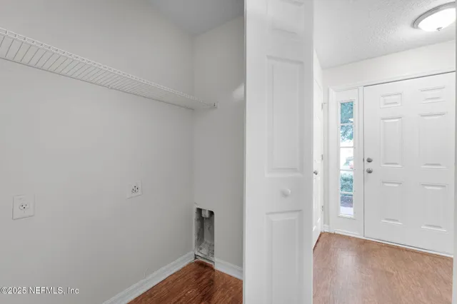 a view of small space with wooden floor