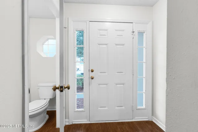 a bathroom with a granite countertop sink