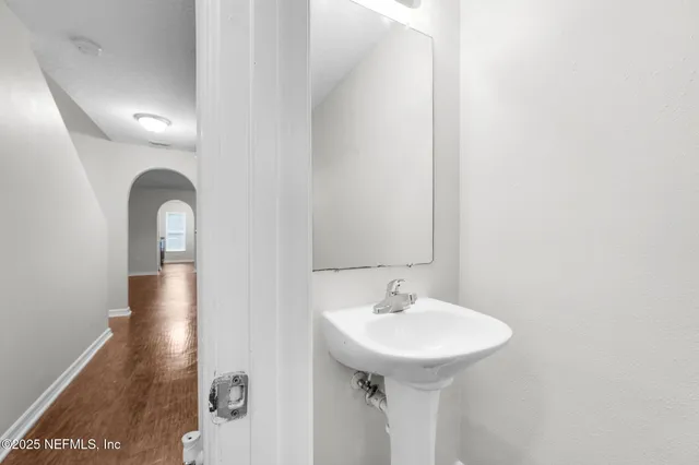 a bathroom with a sink and mirror