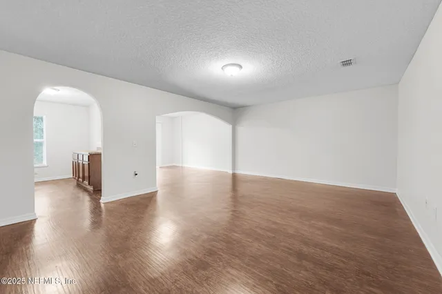 a view of a livingroom with wooden floor