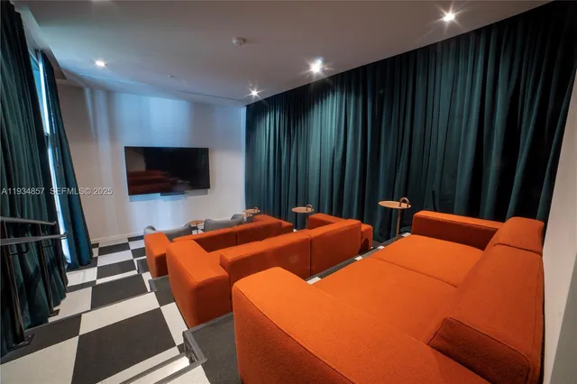 a bed room with two bed and a flat screen tv