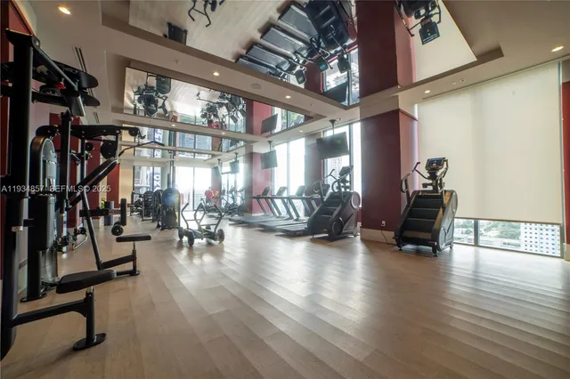 a view of a room with lots of wooden furniture