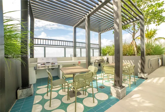 a view of an outdoor dining space with furniture