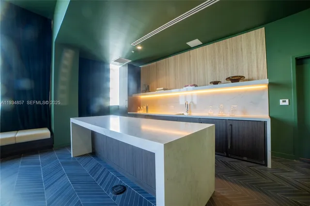 a view of kitchen with wooden floor