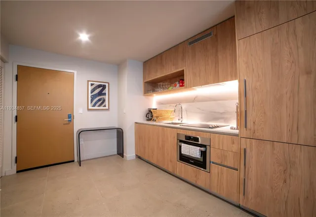 a kitchen with stainless steel appliances granite countertop a stove and a refrigerator