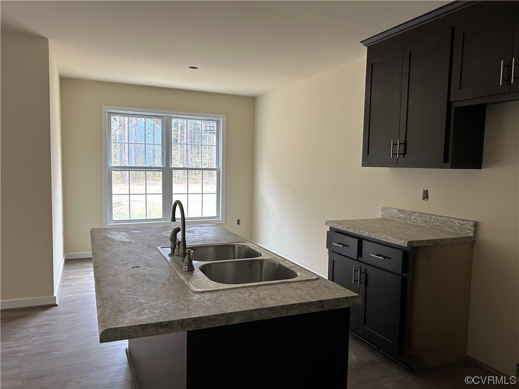 9042 Railroad Bed Road Carson, VA 23830 - Photo 3 of 21 a kitchen with granite countertop a sink and a stove