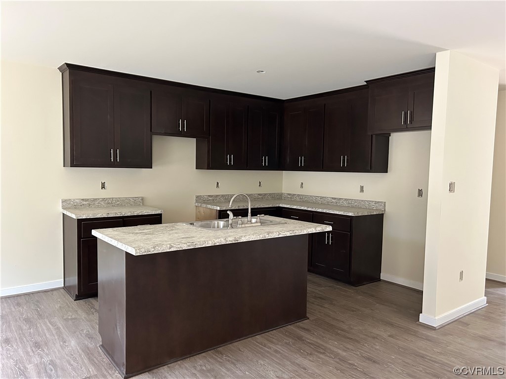 9042 Railroad Bed Road Carson, VA 23830 - Photo 5 of 21 a kitchen with a sink dishwasher a stove and a refrigerator with wooden floor