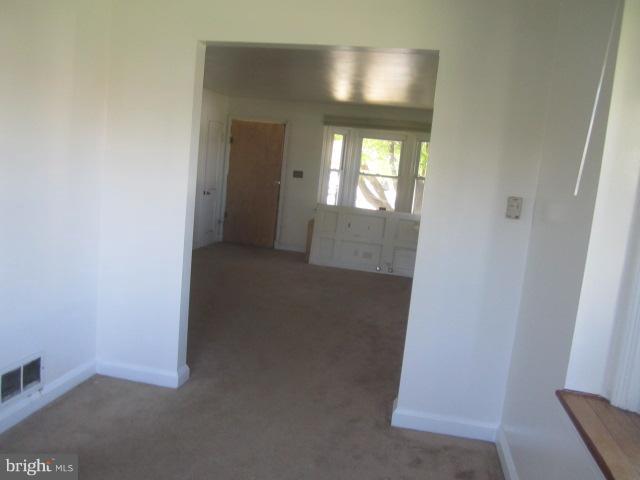 7900 Lynch Road Baltimore, MD 21222 - Photo 8 of 21 an empty room with closet and windows