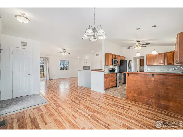a utility room with cabinets washer and dryer