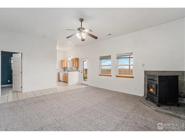 a kitchen with a sink a stove and cabinets