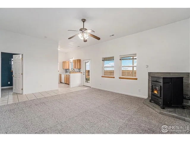 a kitchen with a sink a stove and cabinets